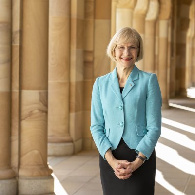 UQ Vice-Chancellor stands in the cloisters of the Great Court at the St Lucia campus.